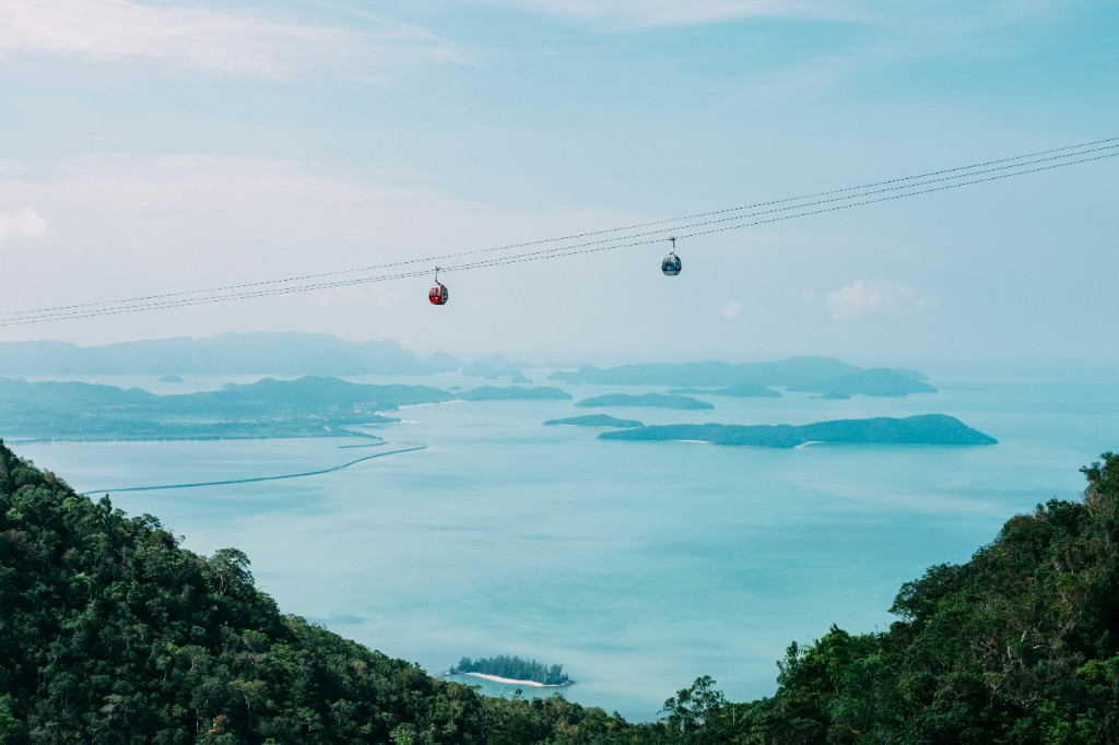 SkyCab gondolas above turquoise sea and forested islands of the Langkawi archipelago